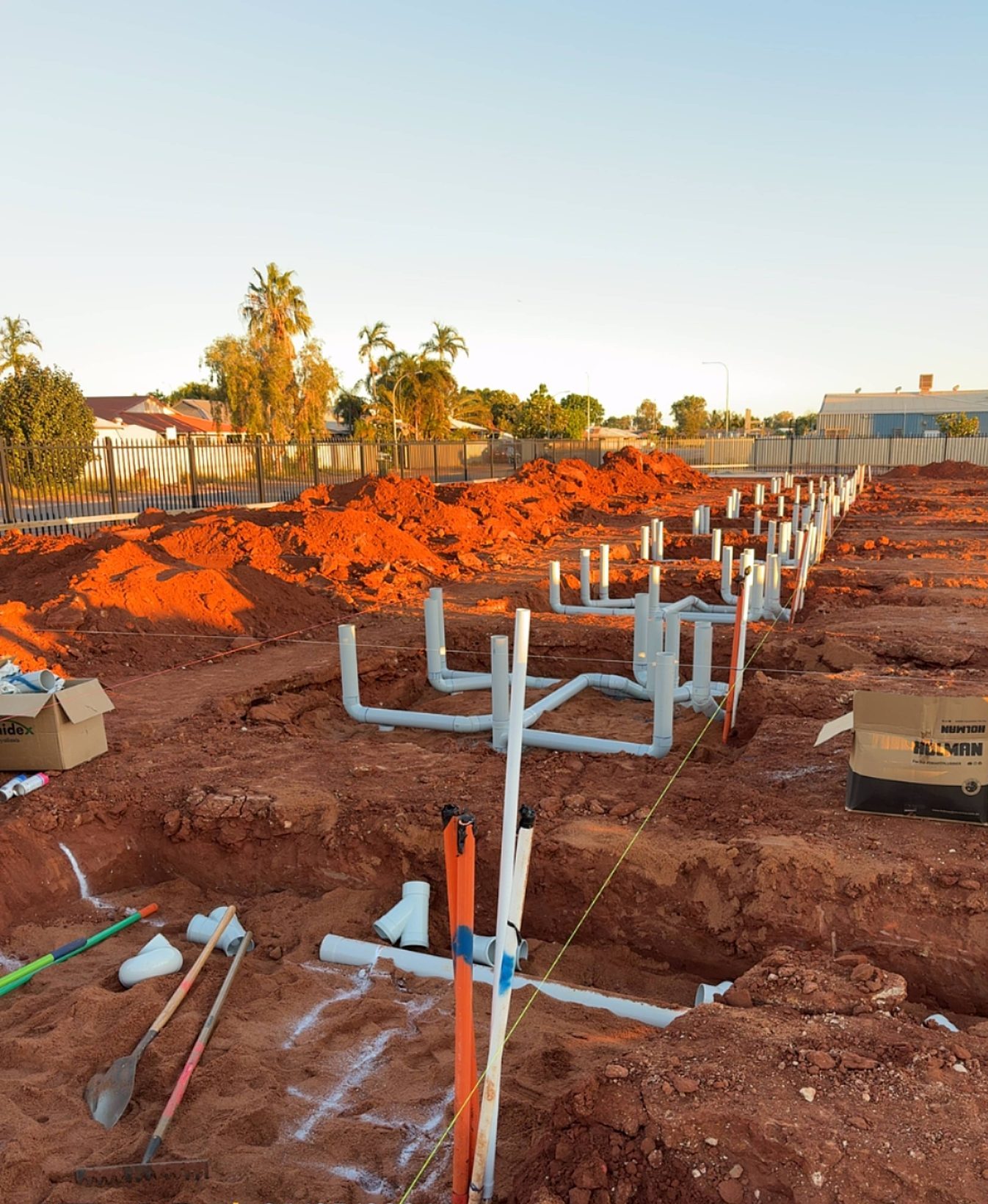 PVC sewer pipework set out in a slab excavation